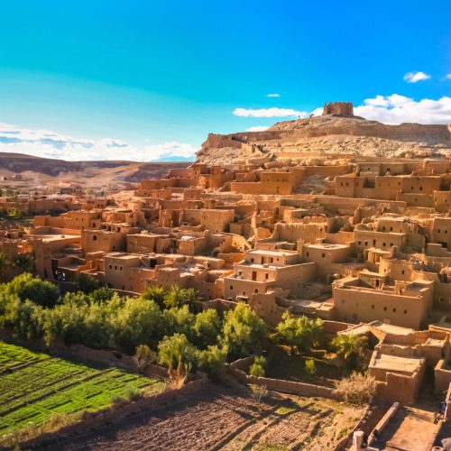 Ait Benhaddou is a fortified city, or ksar, along the former caravan route between the Sahara and Marrakech in present day Morocco. It is situated in Souss Massa Draa on a hill along the Ounila River and is known for its kasbah.